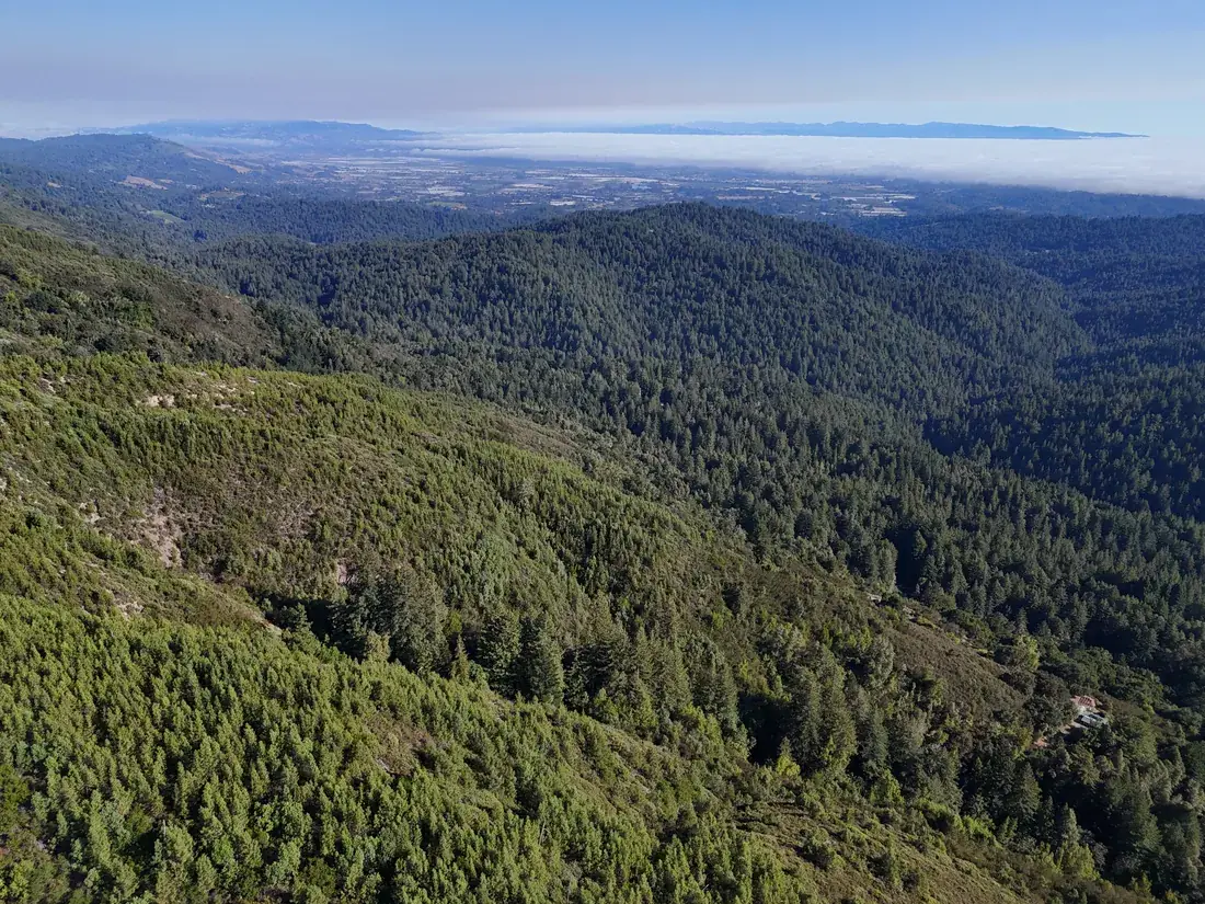 South-facing ridges falling away toward the Monterey Bay horizon